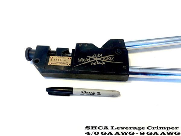 A Sky High Car Audio 8-4/0 Gauge Cable Crimper with a marker and a pen on it.