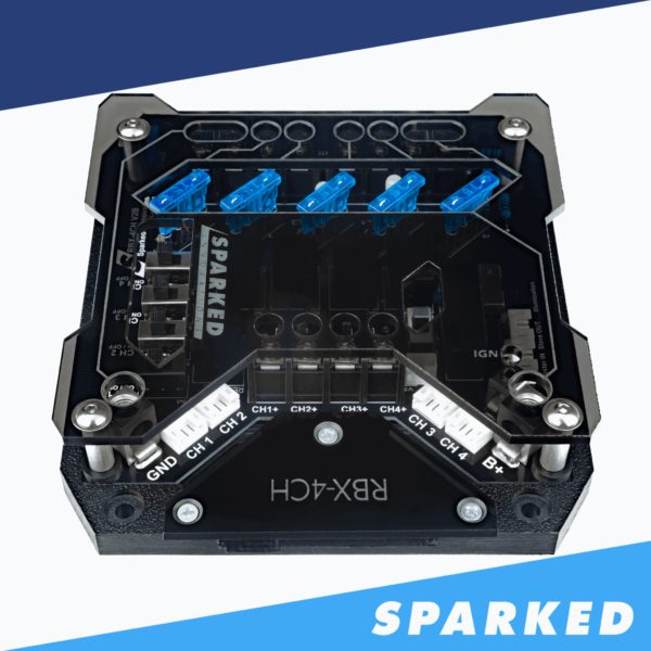 A black and blue Spraked Innovations RBX-4CH Special Edition board with the words sparkled on it.