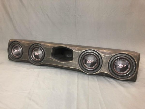 A Gately Audio Perfect Fit Ford 4x8 Crewcab F150/250/350 with four speakers on it.