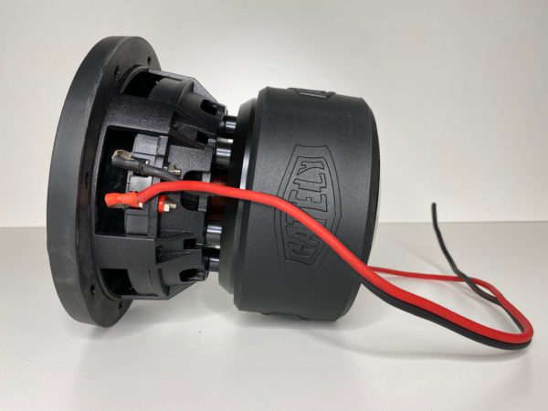 A Gately Audio Relentless 6.5 Inch Subwoofer with a red wire attached to it.