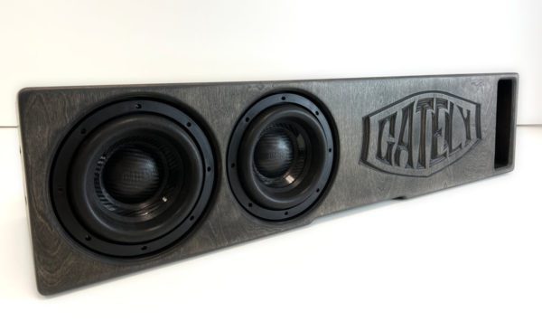A Gately Audio Perfect Fit Jeep 2x8 Gladiator Underseat box with two speakers on it.