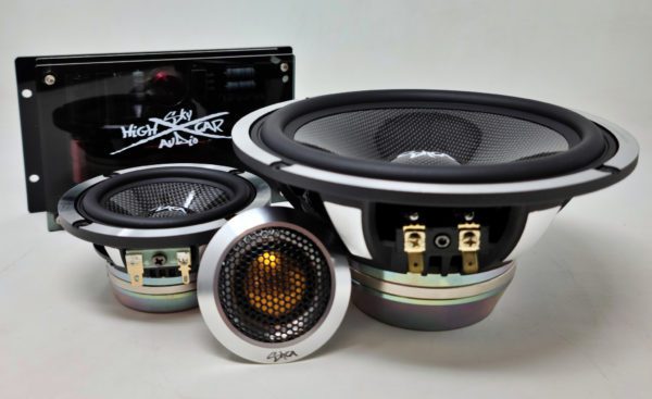 A pair of Sky High Car Audio 3-Way Premium Neo 6.5 Inch Component Set speakers and a speaker box on a white surface.