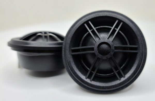 A pair of Sky High Car Audio TW1S Pro Silk Dome Ferrite Tweeters on a white surface.
