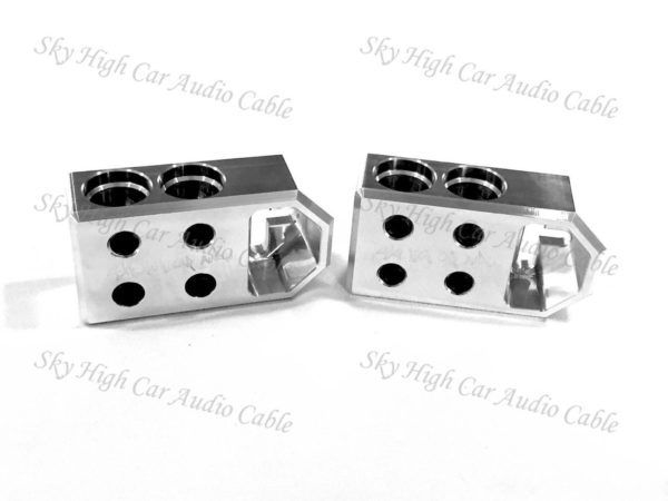 A pair of Sky High Car Audio 4 - 1/0, 2/0 XL or 4/0 XL Battery Terminals with holes on them.