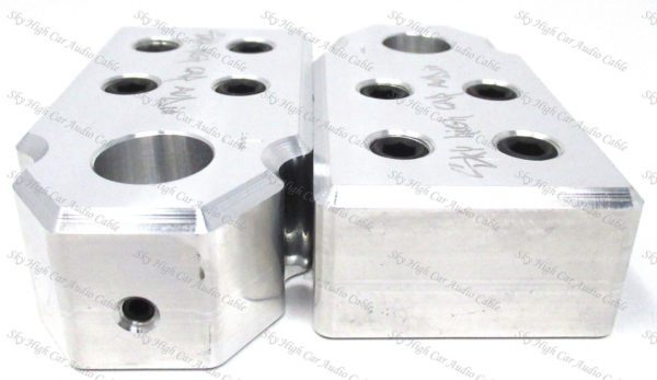 A pair of Sky High Car Audio SAE 4 1/0-4/0 XL Set Screw Battery Terminal aluminum cylinder blocks with holes on them.