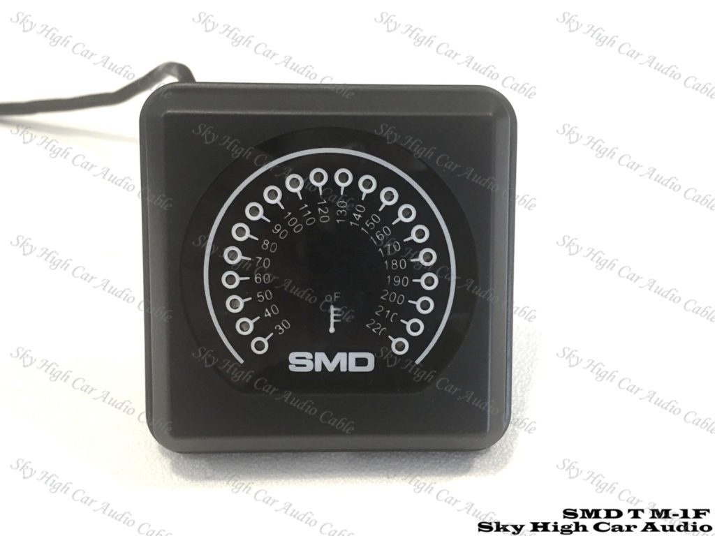 A black and white clock with the word SMD TM-1 LED Amplifier Temperature Meter Fan Controller on it.