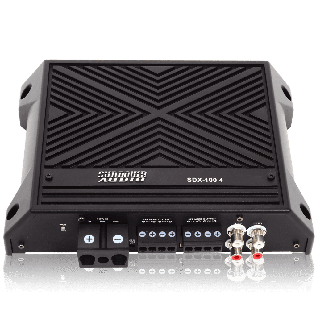 A Sundown Audio SDX-100.4 amplifier with two inputs and two outputs.