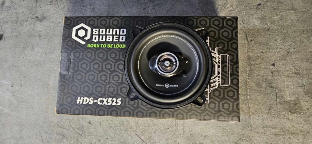 An open box with Soundqubed HDS-CX525 5.25 Inch Coaxial Speakers in it.